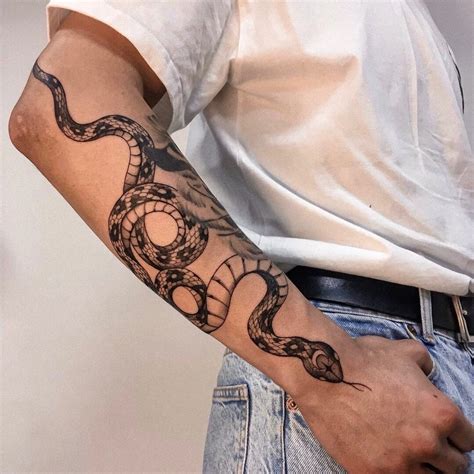 snake wrapping around arm|85 Snake Tattoos That May Have You Wrapping Around The Idea